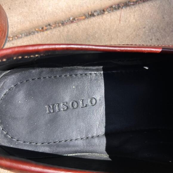Brown leather loafers with a